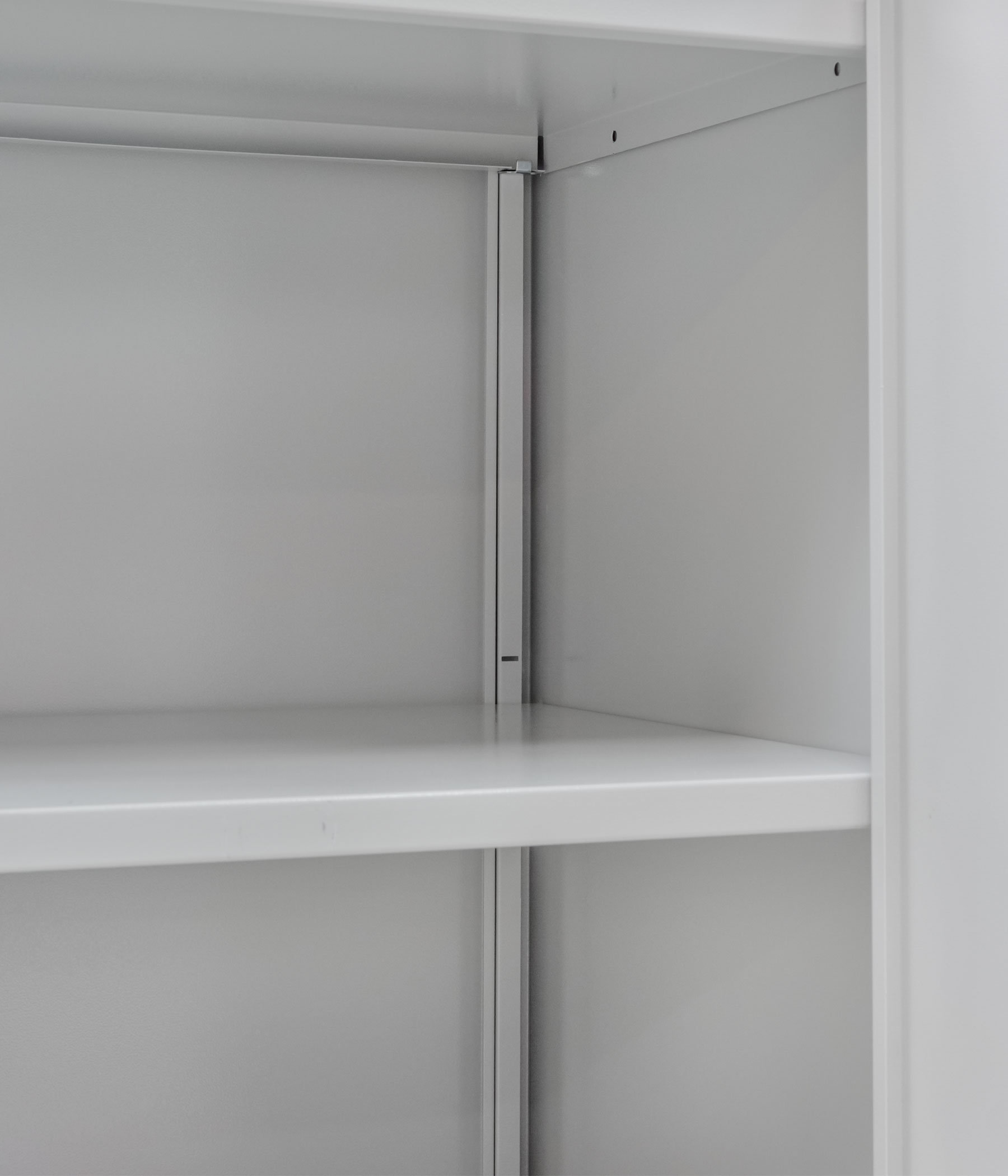 Metal shelves of an office cabinet